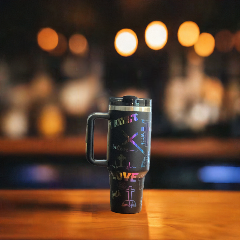 Stylish laser engraved 40oz tumblers showcasing personalized designs and vibrant colors against a blurred background