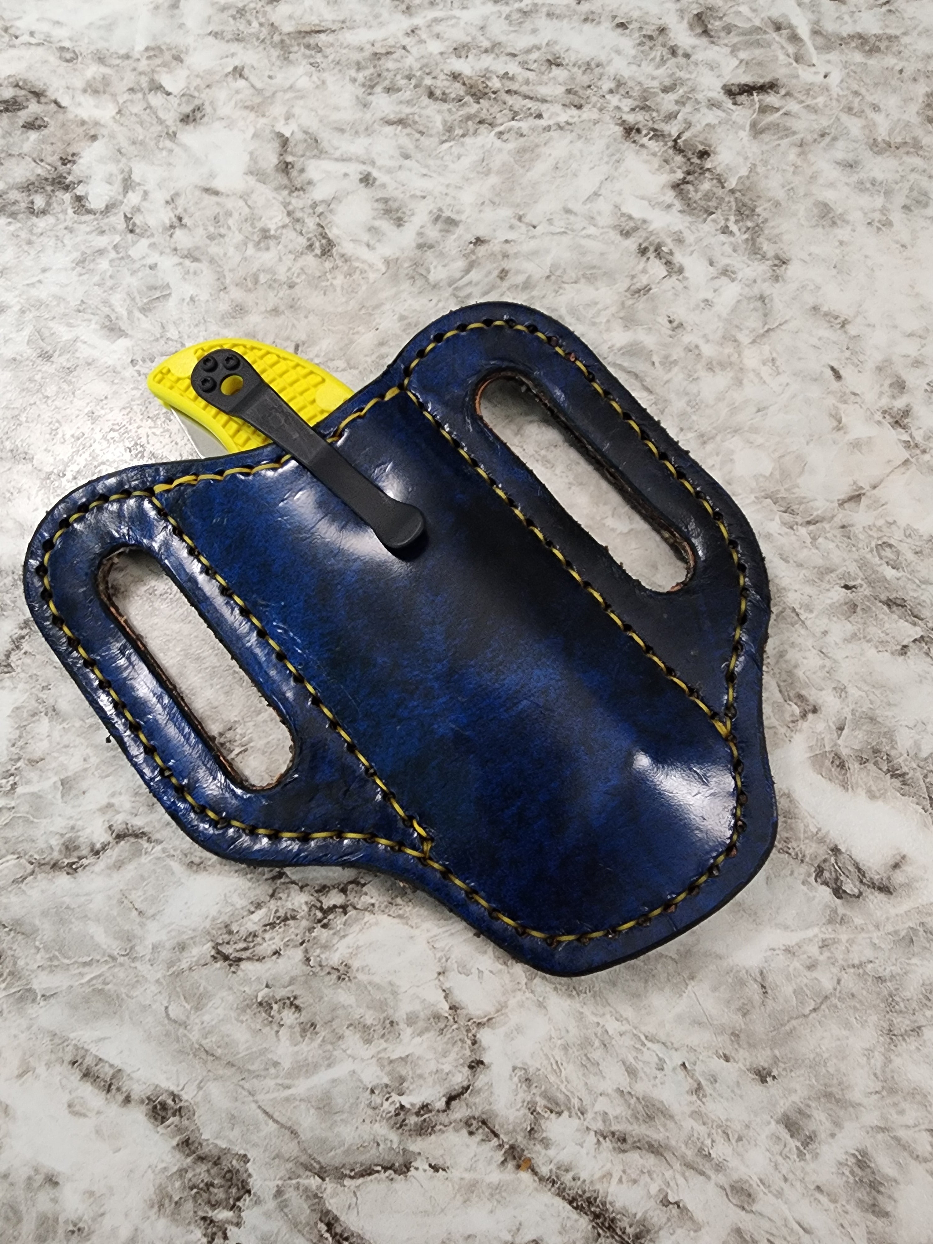 Fox Tree Creations custom leather knife sheath with lue and black leather.