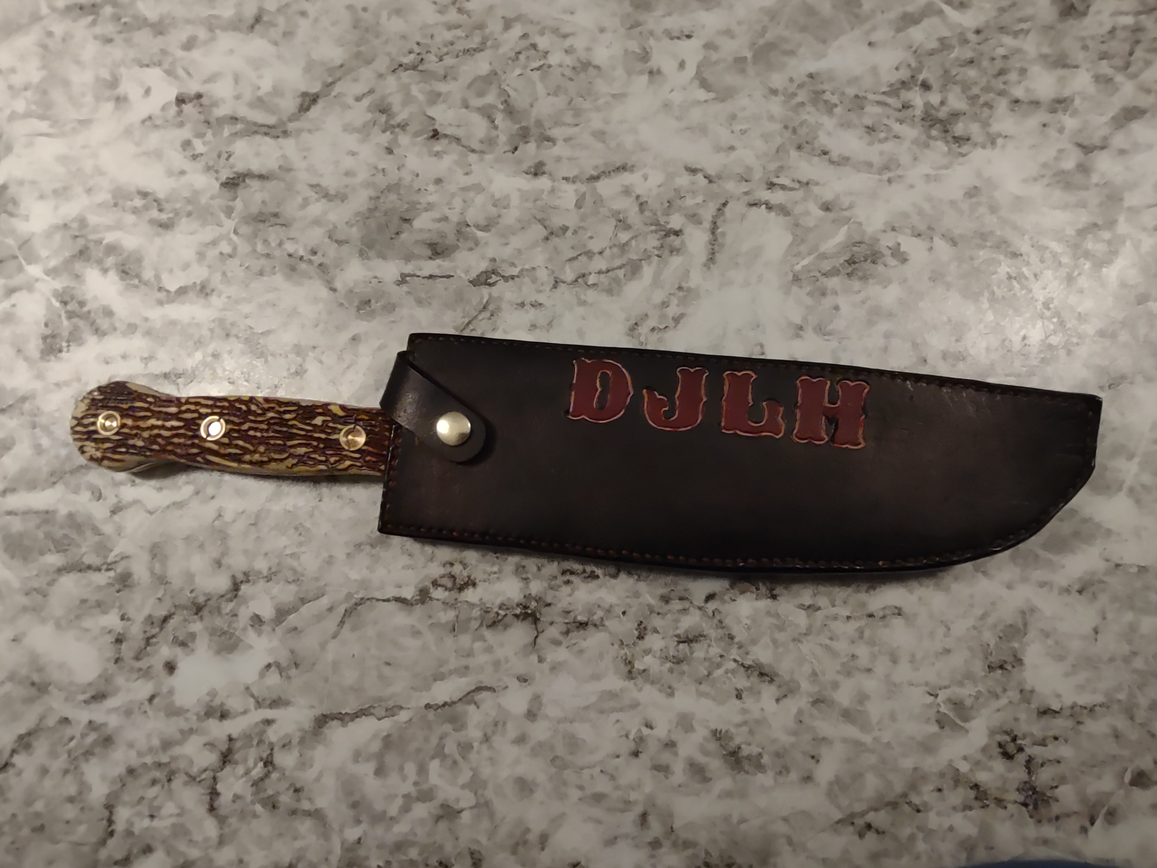 Fox Tree Creations custom leather knife sheath with the initials DJLH.