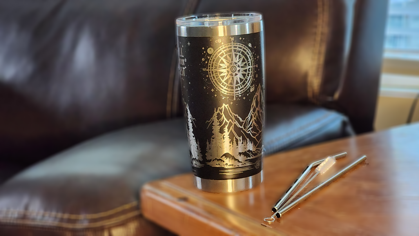 Custom laser engraved wanderer 20oz tumbler featuring mountain and compass designs on a sleek black background