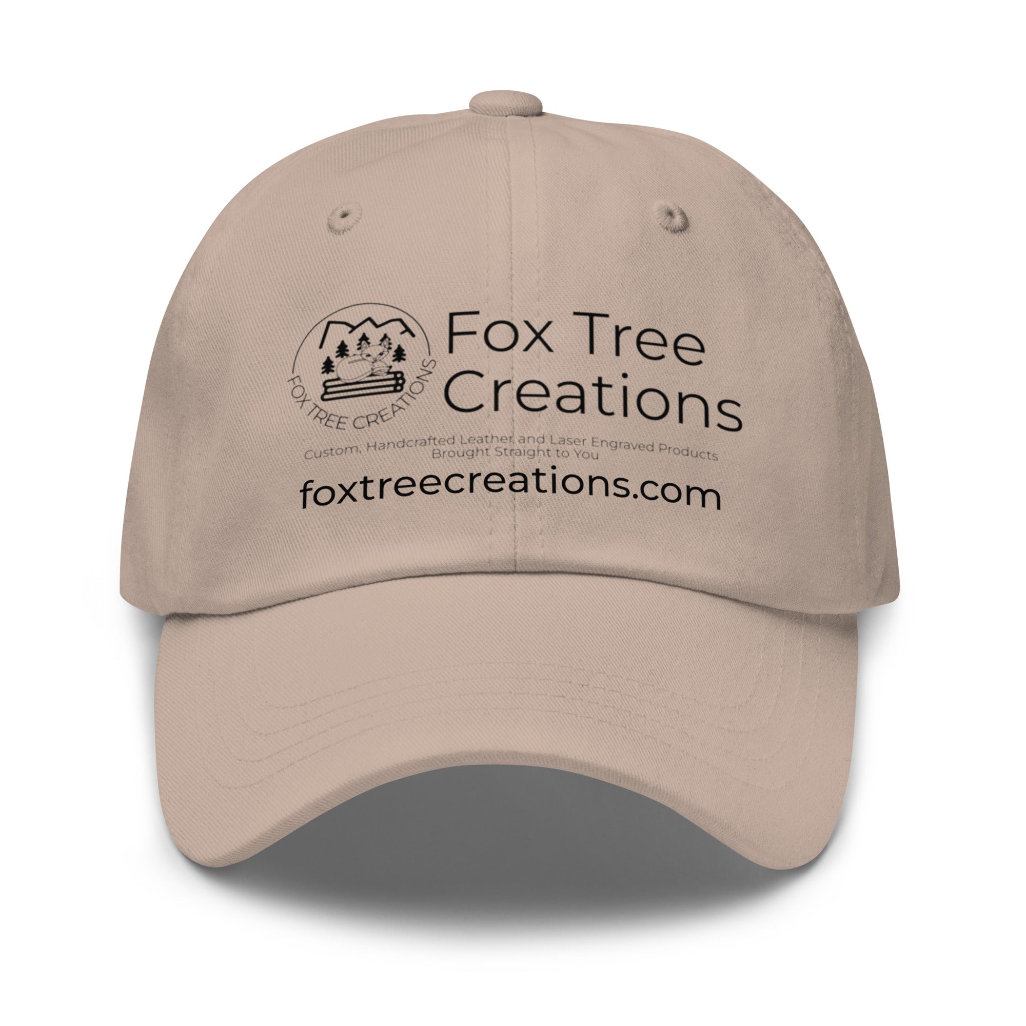 Beige Fox Tree Creations hat featuring an engraved logo for stylish outdoor wear