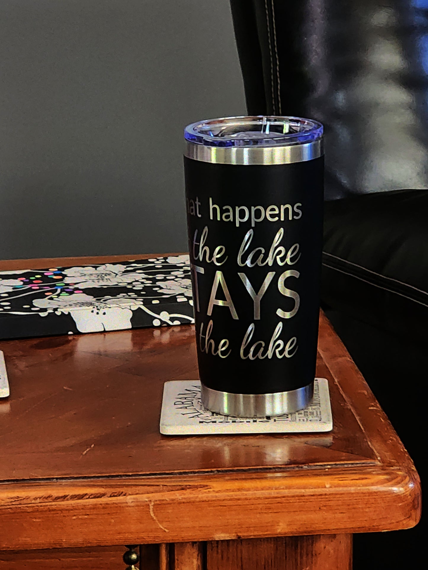 Personalized engraved 20oz tumbler with lake-themed design on a wooden table