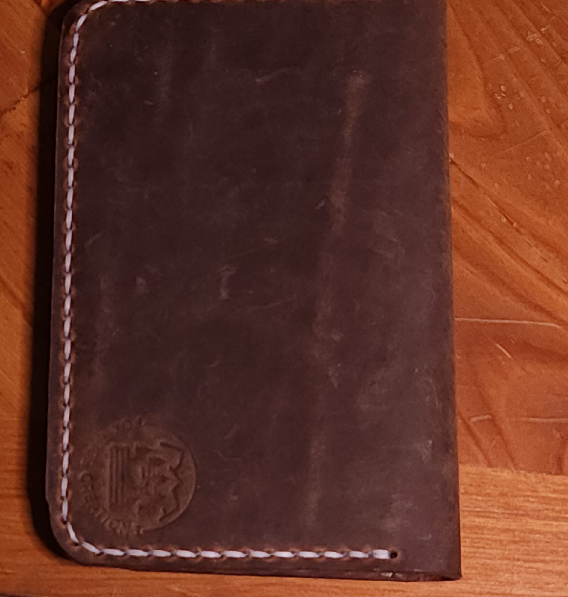 Dark brown full grain leather field notes cover with white stitching by Fox Tree Creations
