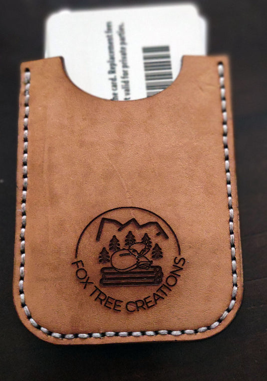 Fox Tree Creations minimalist card wallet in tan leather with an embossed logo and stitched edges