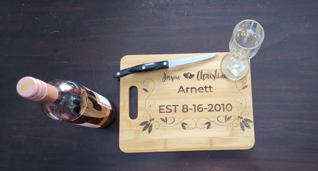 Personalized anniversary cutting board from Fox Tree Creations with engraved names and date