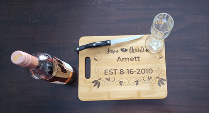 Personalized anniversary cutting board from Fox Tree Creations with engraved names and date