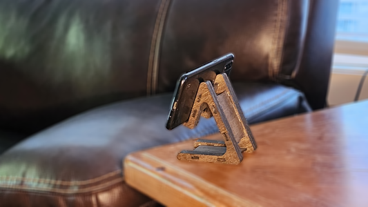 Personalized device stand by Fox Tree Creations displaying a smartphone on a wooden table