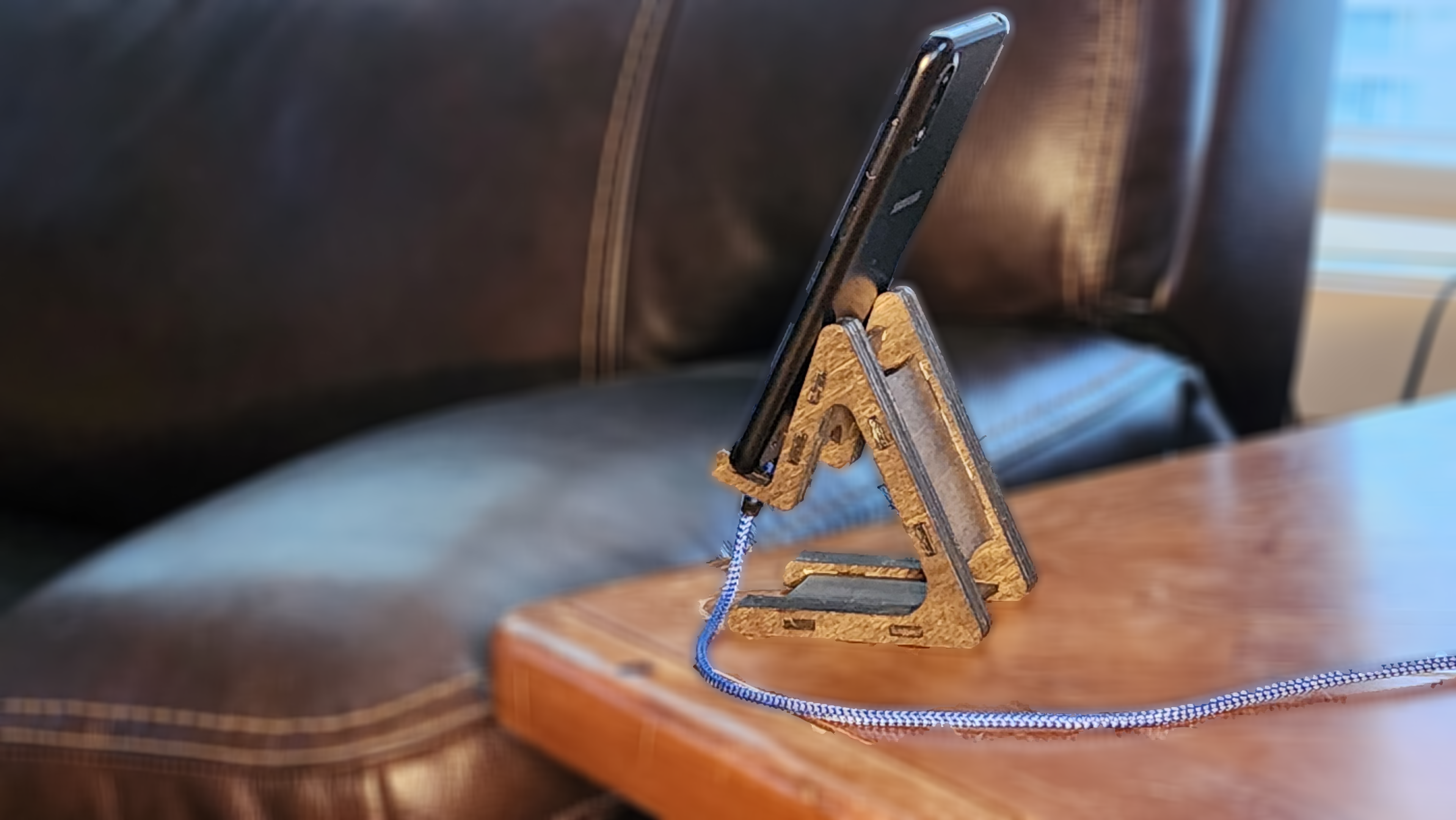 Stylish personalized device stand from Fox Tree Creations supporting a smartphone on a wooden table