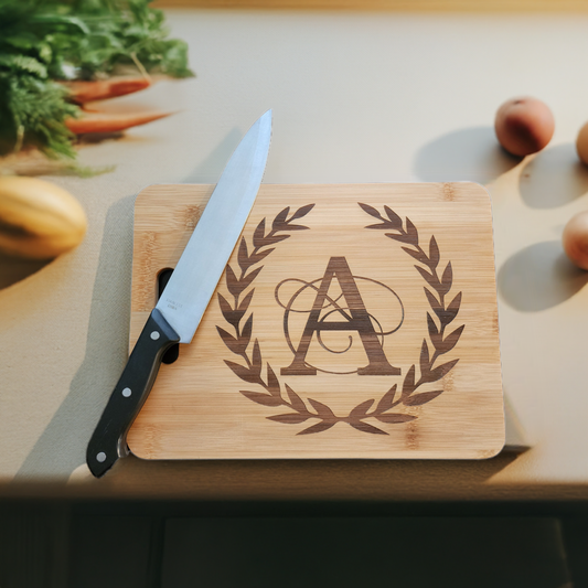 Personalized monogram cutting board from Fox Tree Creations with elegant design and a chef's knife