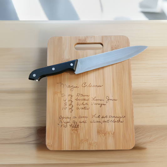 Personalized recipe cutting board from Fox Tree Creations with engraved recipe and chef knife