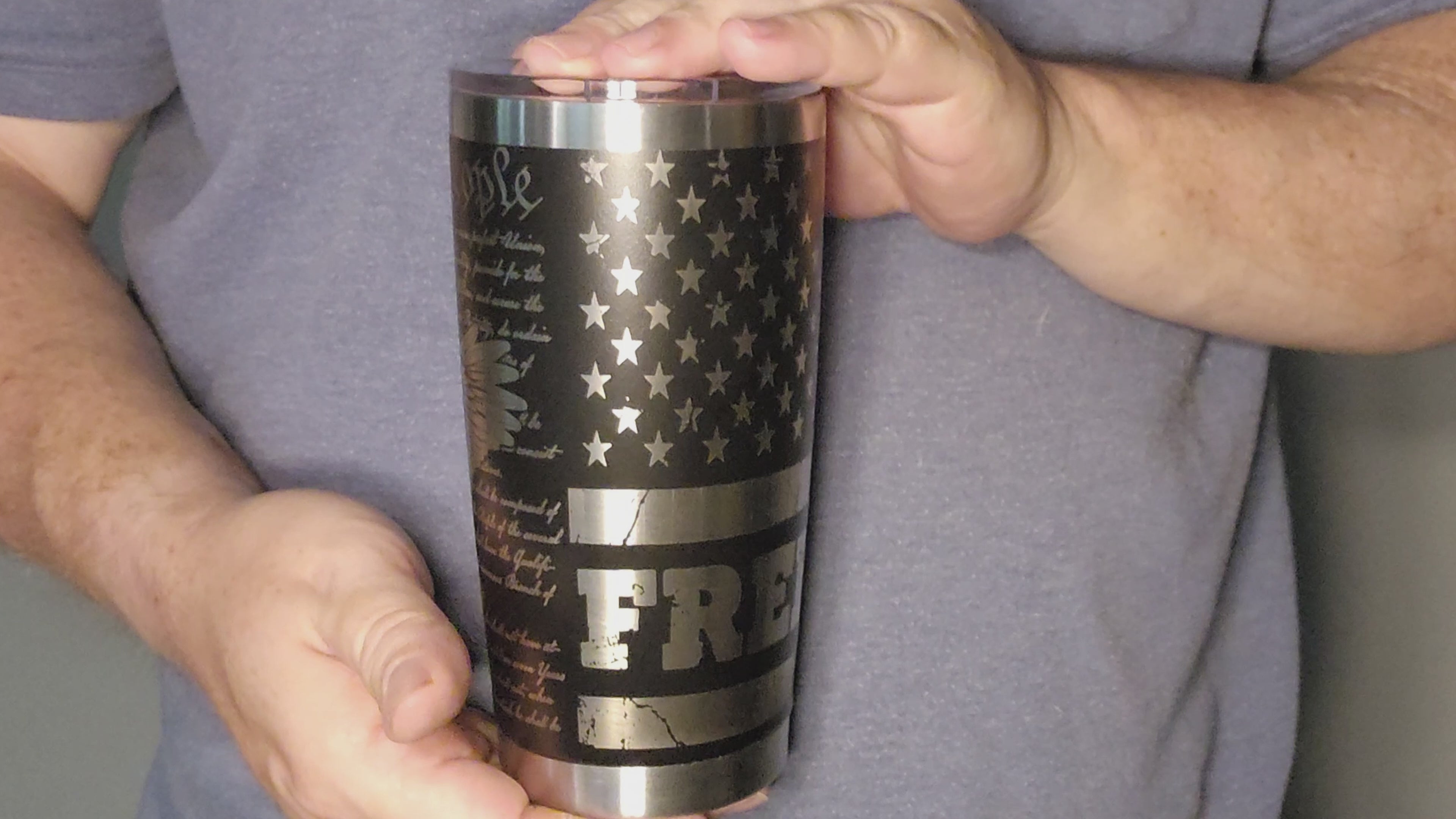 Video showing Custom engraved freedom 20oz tumbler featuring a black and silver American flag design
