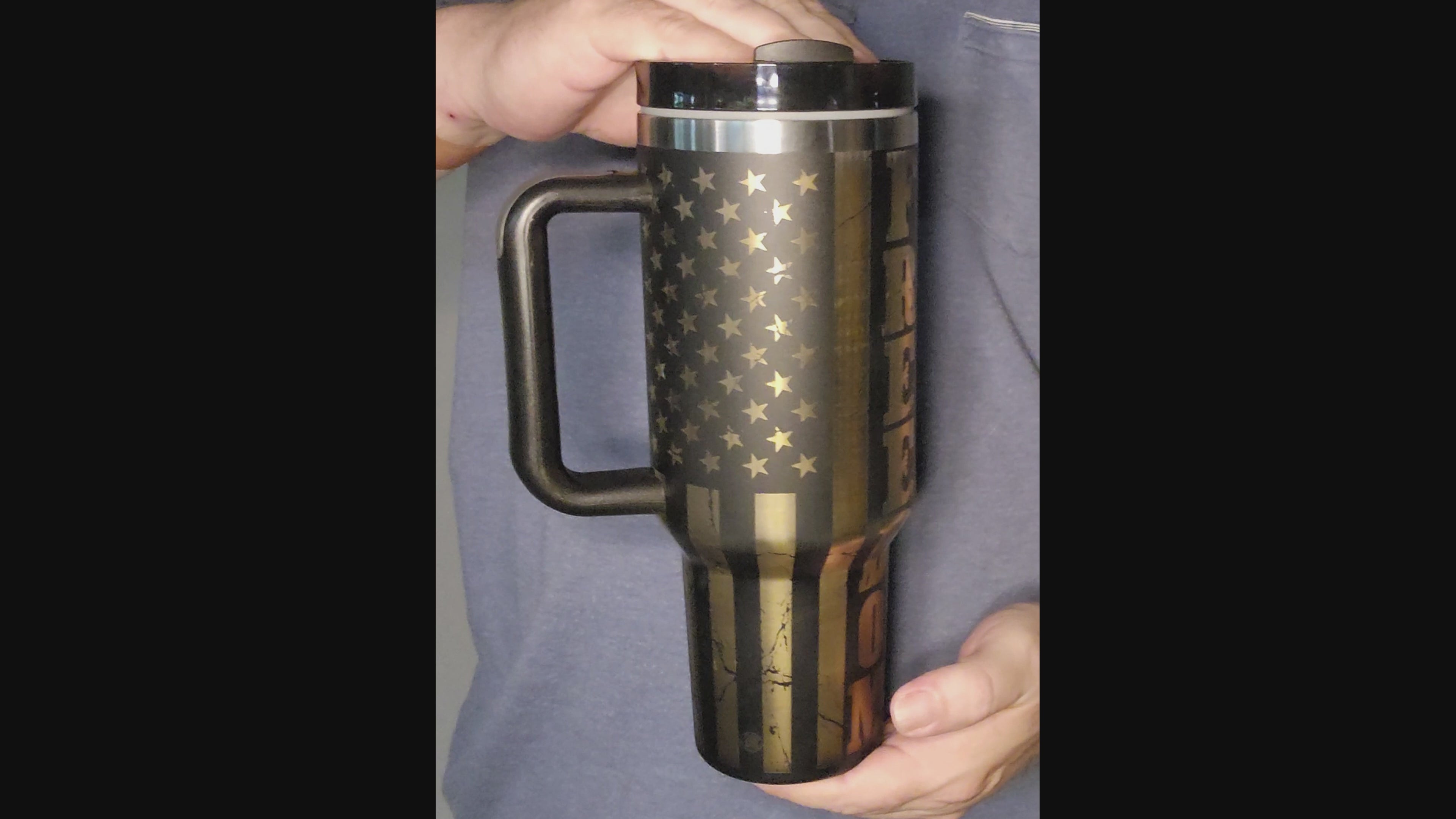 Video showing Custom engraved Freedom 40oz tumbler by Fox Tree Creations featuring a sleek black design for stylish hydration