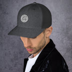 Unique gift trucker cap in dark gray featuring a round logo design for stylish casual wear