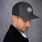Stylish gray unique gift trucker cap featuring a logo, perfect for casual outings or as a thoughtful gift