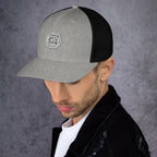 Stylish gray and black unique gift trucker cap with logo detail, perfect for casual wear.