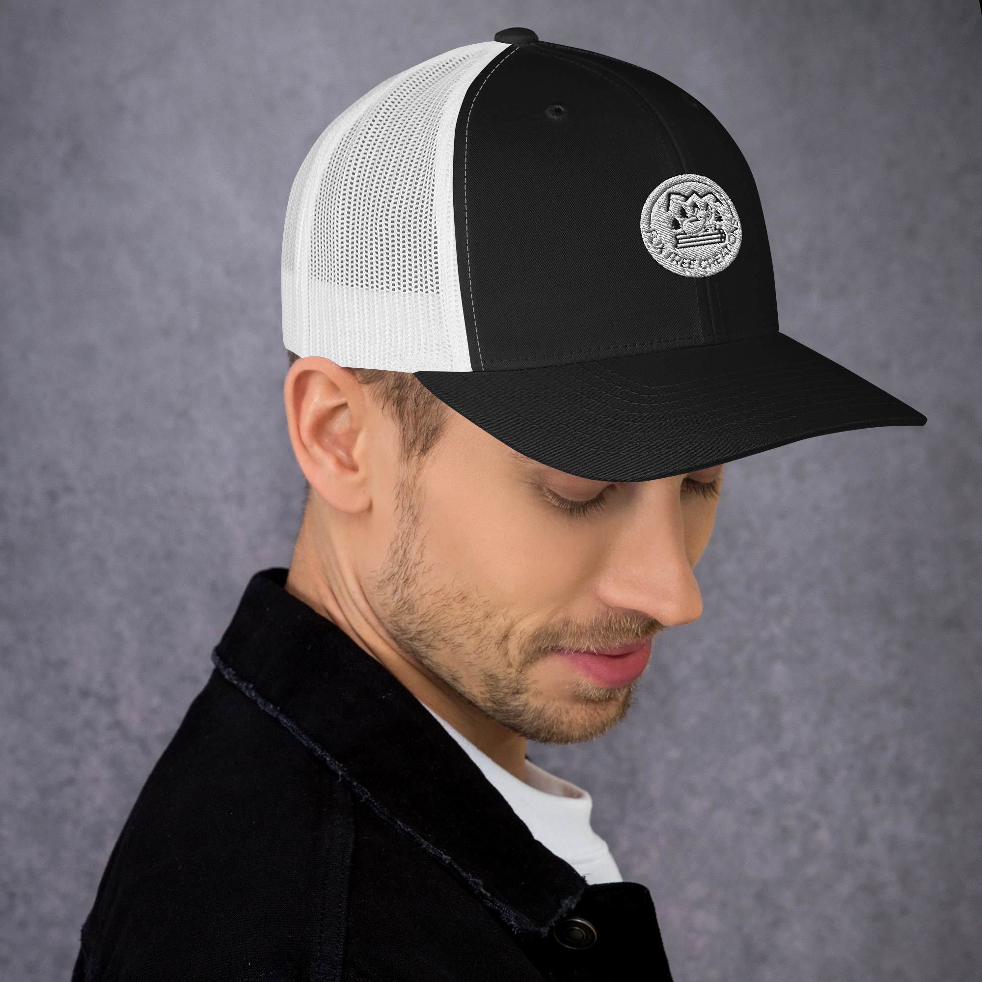 Stylish black and white trucker cap from Fox Tree Creations, a unique gift trucker cap for casual wear